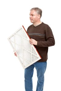 man-considers-changing-air-filter