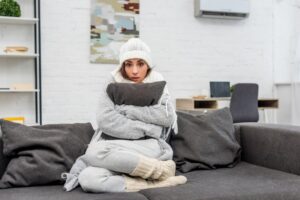 woman-looking-cold-in-home